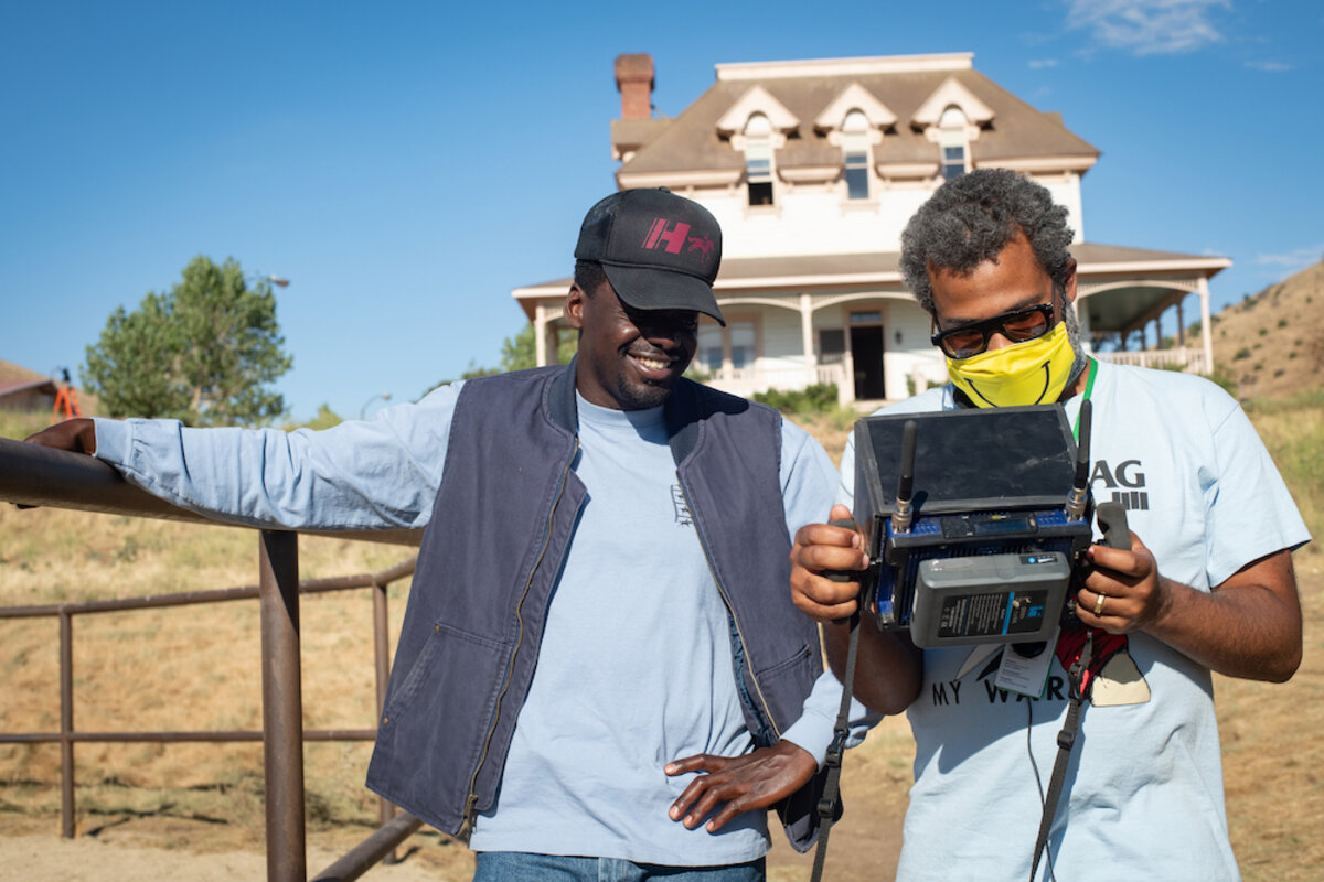 Jordan Peele and Daniel Kaluuya review footage on the set of Nope.